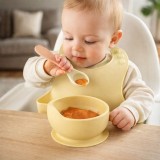 Cumpara ieftin Set din silicon cu bol bavetica si lingurita pentru bebe - Galben