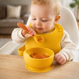 Cumpara ieftin Set din silicon cu bol bavetica si lingurita pentru bebe - Galben mustar