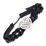 Brățară neagră și plăcuță din metal cu un nod celtic &icirc;n formă de inimă