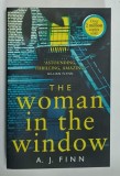 THE WOMAN IN THE WINDOW by A.J. FINN , 2018, MICI PETE PE BLOCUL DE FILE