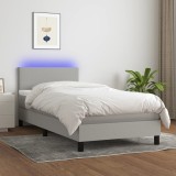 Pat Gossi 90x190 cm, arcuri, saltea, LED, gri deschis, textil. Cadru pat, tablie, protectie saltea inclusa. Conector USB
