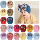 Caciulita tip turban cu fundita inflorata (Marime Disponibila: 6-9 luni