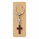 Cumpara ieftin Breloc religios cruce din lemn cu contur metalic si inel rotativ, accesoriu crestin pentru chei sau rucsac, design compact