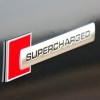 Emblema auto model &quot;SUPERCHARGED&quot;, reliefata 3D, dimensiune 10 x 1 cm