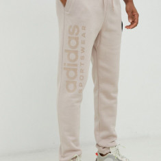 Adidas pantaloni de trening barbati, culoarea bej, cu imprimeu