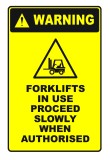 Sign warning forklifts in use proceed slowly when authorised