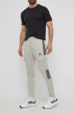 Cumpara ieftin Adidas pantaloni de trening TIRO culoarea verde, cu imprimeu, IS1544