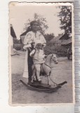 bnk foto Copii cu jucarii - Copil cu balansoar calut - 1933