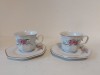 Set 2 cesti de ceai / cafea. cu farfurioare, portelan fin, anii 80, Romania, Apulum, Alba Iulia, 7cm inaltime, model cu flori de cires