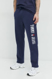 Cumpara ieftin Tommy Jeans pantaloni de trening din bumbac barbati, culoarea albastru marin, cu imprimeu