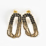 Cercei aurii cu pietre negre si design curbat in lanturi multiple