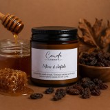 Miere și Stafide lum&acirc;nare parfumată din ceară naturală de soia &icirc;n sticlă ambră