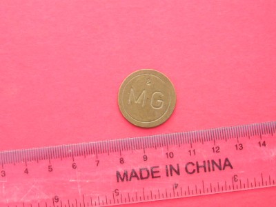 M3C1 7 - Jeton de colectie - inscriptia MG foto