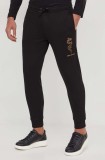 Armani Exchange pantaloni de trening din bumbac culoarea negru, cu aplicații