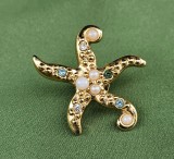 BROSA - PIN DIN METAL AURIU, MODEL STEA DE MARE DECORATA