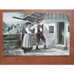 Carte postala, barbat si femeie in costume traditionale, inceput de secol XX