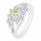 Inel cu braţe lucioase, despicate, floare transparentă cu centru galben - Marime inel: 58