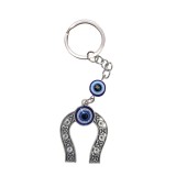 Cumpara ieftin Breloc potcoava norocoasa si ochi de protectie spirituala, inox, argintiu