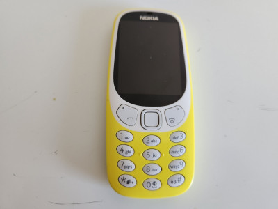 Telefon Nokia 3310 folosit galben nu incarca pentru piese foto