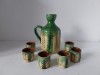 Set pentru tuica, vechi, ceramică rustică, lucrat manual &ndash; ulcior cu 6 păhărele glazurate, decor verde-gălbui, semnate (Bagavy / EB)