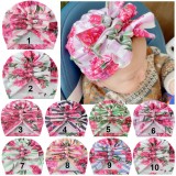 Caciulita tip turban inflorata cu fundite in fata (Marime Disponibila: 6-9 luni