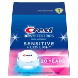 Benzi pentru albirea dinților Crest 3D White Whitestrips Sensitive, 6%, cu lampă UV, 14 plicuri (28 benzi)