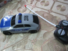 Masinuta de politie cu telecomanda 1:64 foto