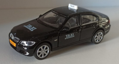 Macheta BMW 330i (E90) 2009 Taxi Stockolm - Welly 1/36 foto