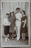 Elev premiant in uniforma si cu carti impreuna cu familia// foto tip CP, Romania 1900 - 1950, Portrete