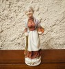 BIBELOU DIN PORTELAN FIN- BUNICUTA CU UN COS CU FRUCTE H12,5CM
