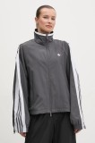 Adidas Originals geacă WOVEN TT ZIP femei, culoarea gri, de tranziție, oversize, JY8879