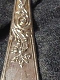 Furculita veche ornata in relief,MONOGRAMA.tacam vechi pentru completarea setului de furculite vintage.stantate
