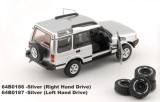 Macheta Land Rover Discovery 1 1998 argintiu, scara 1:64 &ndash; BM Creations cu roti off-road suplimentare