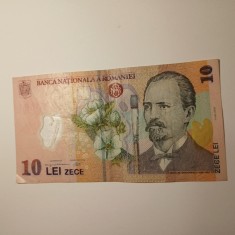 Di.141. Bancnota 10 lei 2005 circulata, stare uzata foto