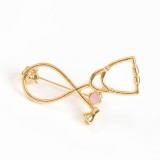 Brosa martisor stetoscop auriu