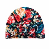 Caciulita inflorata pe fond bleumarin tip turban (Marime Disponibila: 3-6 luni)