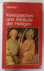 KENNZEICHEN UND ATTRIBUTE DER HEILIGEN ( CARACTERISTICILE SI ATRIBUTELE SFINTILOR ) von WIMMER , TEXT IN LIMBA GERMANA , 1990 foto