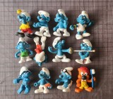 Cumpara ieftin Lot 12 figurine de colectie, vintage: 11 STRUMFI Smurfs Schlumphe Peyo + 1 Castor AOK Putzi, produse originale Bullyland din cauciuc, Germania '78-'80