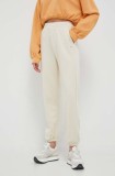 Champion pantaloni de trening culoarea bej, neted