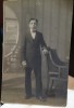 Fotografie tip carte postala, necirculata, tanar cu papion, perioada interbelica