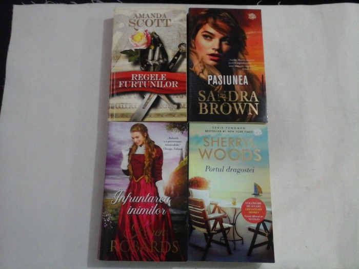 4 romane: Amanda SCOTT (Regele furtunilor) / Karen ROBARDS (Infruntarea inimilor) / Sherryl WOODS (Portul dragostei) / Sandra BROWN (Pas