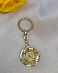 BRELOC DIN METAL AURIU LUCIOS IN FORMĂ STILIZATA DE RULETA