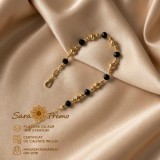 Bratara dama Noir Eclat cu cristale negre si bilute aurii, placata cu aur 18K, 19+5 cm Brazilia