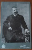 Fotografie pe carton, barbat cu mustata si cioc, inceput de secol XX