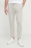 BOSS Orange pantaloni de trening din bumbac culoarea bej, melanj