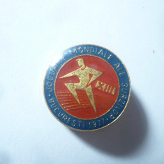 Insigna Sport Romania - Jocurile Mondiale ale Surzilor Bucuresti 1977 ,d=2,2cm