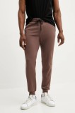 Rip Curl pantaloni de trening culoarea portocaliu, neted