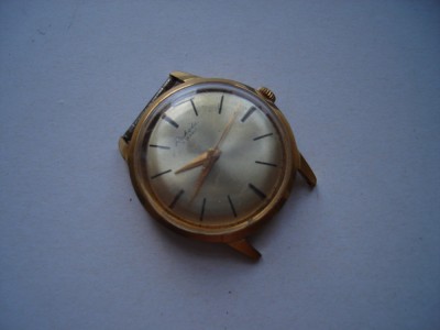 Ceas mecanic sovietic Raketa, carcasa aurita Au20, defect foto