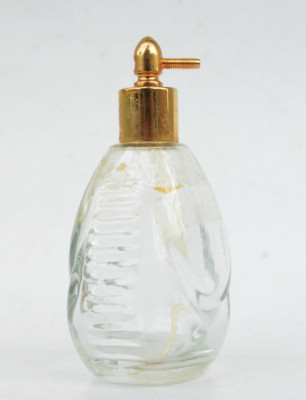 Sticluta veche de parfum din sticla foto