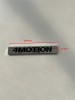 Emblema Auto 4MOTION Metal Nichel 100mm x 15mm, Prindere Banda Dublu Adeziva